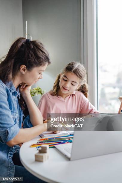 mother helps her daughter to study at home - abacus computer stock pictures, royalty-free photos & images