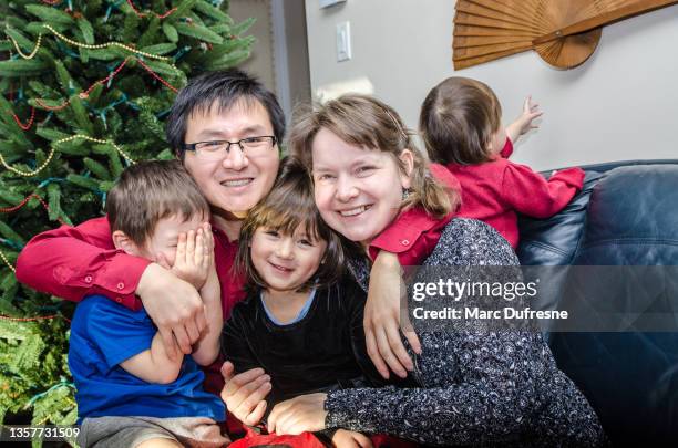 mixed race family having fun - métis stock pictures, royalty-free photos & images