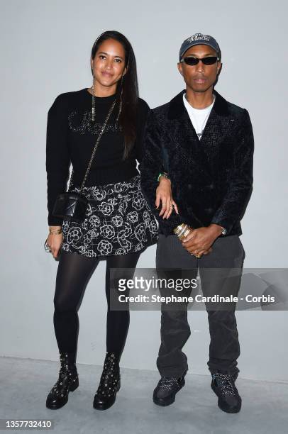 Pharrell Williams and wife Helen Lasichanh attend the Chanel Metiers D'Art 2021-2022 show at Le 19M on December 07, 2021 in Paris, France.