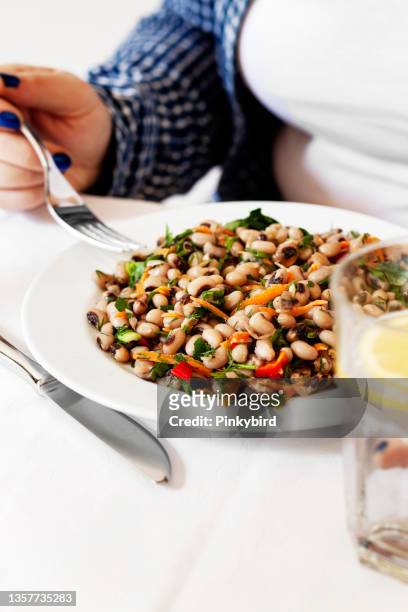 black-eyed pea salad, mixed bean salad, vegetarian bean salad, woman eating fresh salad, - black eyed peas stock pictures, royalty-free photos & images