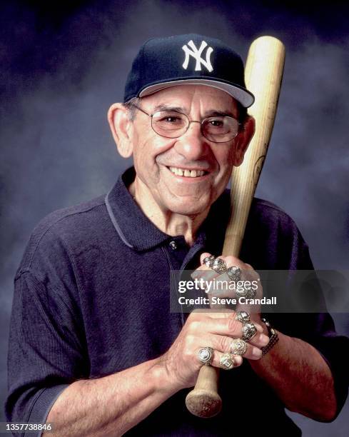 New York Yankees Great, Yogi Berra poses for photos with his 10 World Series rings at Yogi Berra Museum on November 10, 2000 in Montclair, New Jersey.