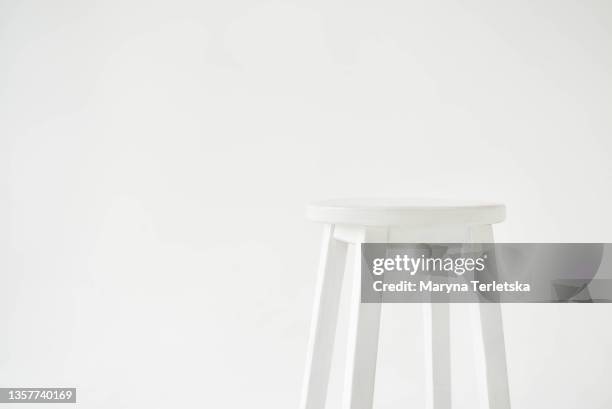 high white chair on a white background. - back of chair stock pictures, royalty-free photos & images