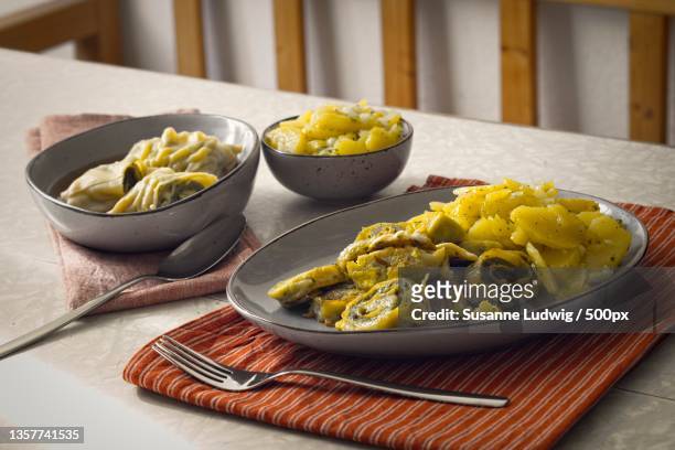 maultaschen,close-up of pasta in plate on table,germany - maultaschen stock pictures, royalty-free photos & images