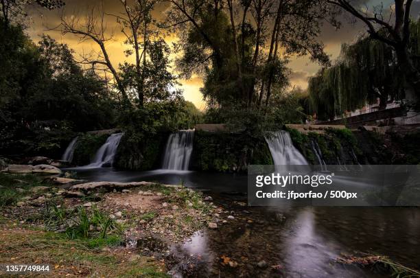 st,scenic view of waterfall in forest against sky,leiria,portugal - leiria district stock pictures, royalty-free photos & images