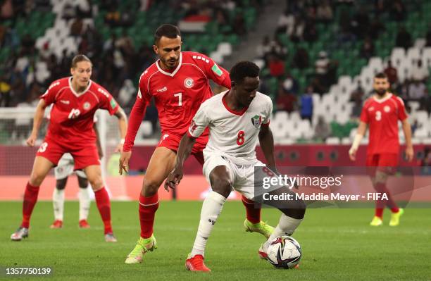 Mohamed Alrashed of Sudan is closed down by Fadel Antar of Lebanon during the FIFA Arab Cup Qatar 2021 Group D match between Lebanon and Sudan at...