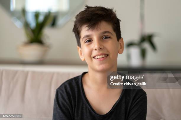 cute boy looking at camera - turkish boy stockfoto's en -beelden