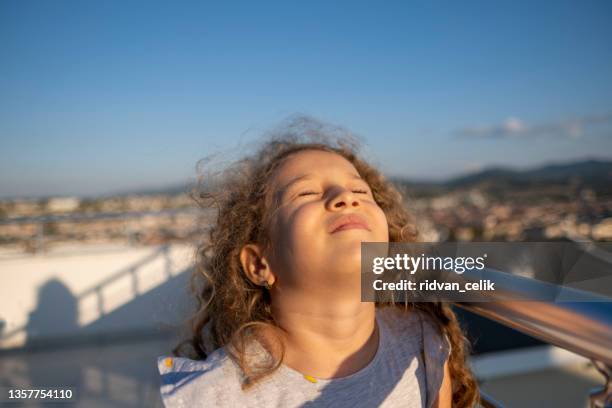 joyful little girl with flying hair - hazel eyes stock pictures, royalty-free photos & images