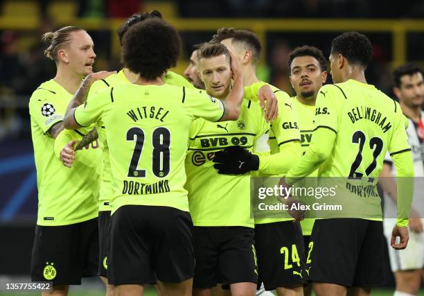 Marco Reus f Dortmund celebrates scoring his team's second goal from the penalty spot with his team mates during the UEFA Champions League group C...