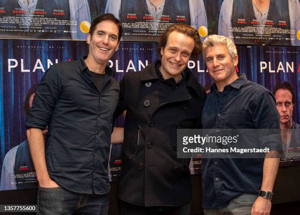 Director Doron Paz, actor August Diehl and Yoav Paz attend the premiere of the movie "Plan A" at Rio Palast on December 07, 2021 in Munich, Germany.