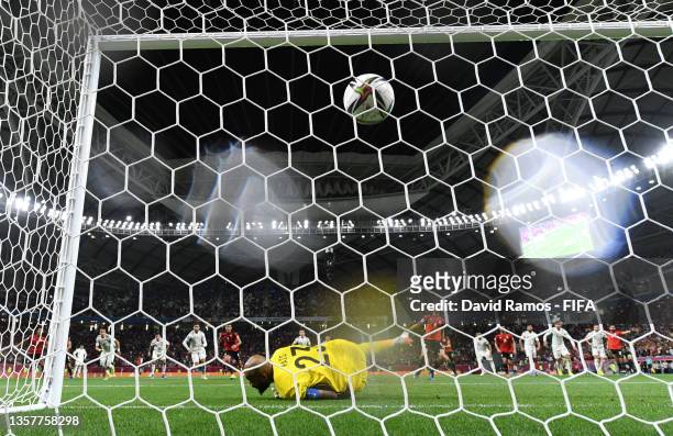 Amro Elsoulia of Egypt scores their team's first goal from the penalty spot past Rais Mbolhi of Algeria during the FIFA Arab Cup Qatar 2021 Group D...