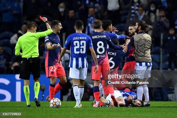 Yannick Ferreira Carrasco of Atletico Madrid is shown a red card by Match Referee, Clement Turpin during the UEFA Champions League group B match...