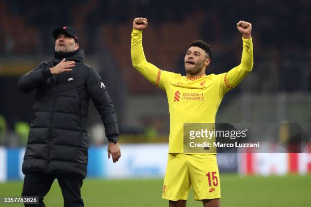 Juergen Klopp, Manager of Liverpool and Alex Oxlade-Chamberlain of Liverpool celebrates their side's victory after the UEFA Champions League group B...