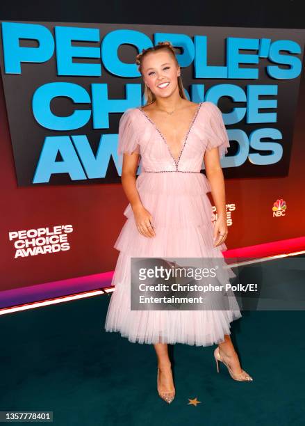 Pictured: JoJo Siwa arrives to the 2021 People's Choice Awards held at Barker Hangar on December 7, 2021 in Santa Monica, California.
