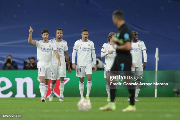 Marco Asensio of Real Madrid CF celebrates scoring their second goal with teammates Eder Gabriel Militao , Mariano Diaz , Luka Modric and Ferland...