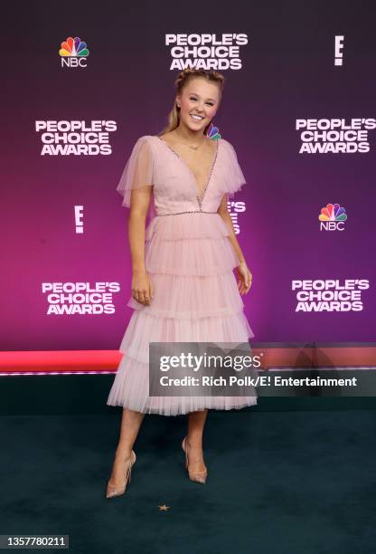 Pictured: JoJo Siwa arrives to the 2021 People's Choice Awards held at Barker Hangar on December 7, 2021 in Santa Monica, California.