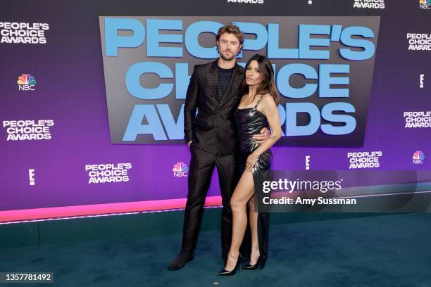 Adam Demos and Sarah Shahi attend the 47th Annual People's Choice Awards at Barker Hangar on December 07, 2021 in Santa Monica, California.