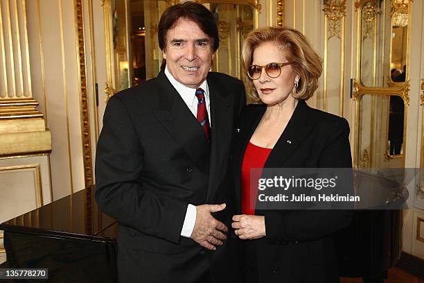 Sylvie Vartan poses with her husband Tony Scotti after being awarded Commandeur des Arts et Lettres at Ministere de la Culture on December 14, 2011...