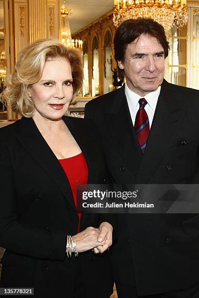 Sylvie Vartan poses with her husband Tony Scotti before being awarded Commandeur des Arts et Lettres at Ministere de la Culture on December 14, 2011...