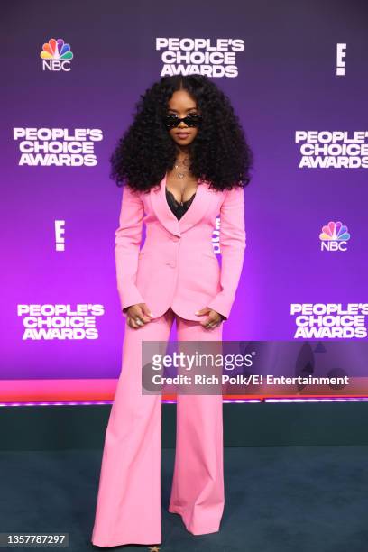 Pictured: H.E.R. Arrives to the 2021 People's Choice Awards held at Barker Hangar on December 7, 2021 in Santa Monica, California.