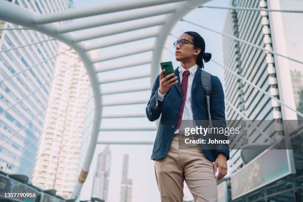 businessman is waiting for a train - bangkok business stock pictures, royalty-free photos & images