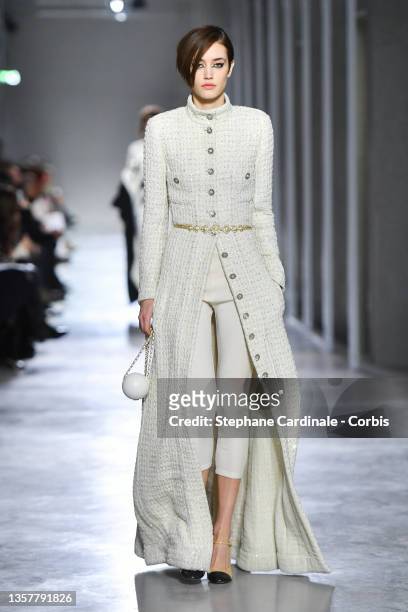 Model walks the runway during the Chanel Metiers D'Art 2021-2022 show at Le 19M on December 07, 2021 in Paris, France.