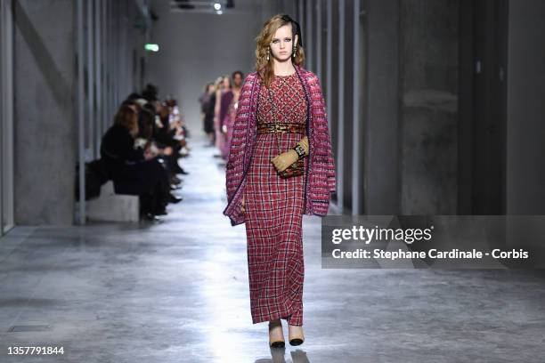 Model walks the runway during the Chanel Metiers D'Art 2021-2022 show at Le 19M on December 07, 2021 in Paris, France.