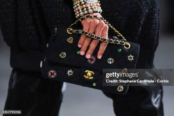 Model walks the runway during the Chanel Metiers D'Art 2021-2022 show at Le 19M on December 07, 2021 in Paris, France.