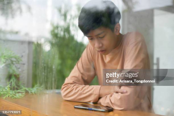 asian boy student using smartphone - boy thailand stock pictures, royalty-free photos & images