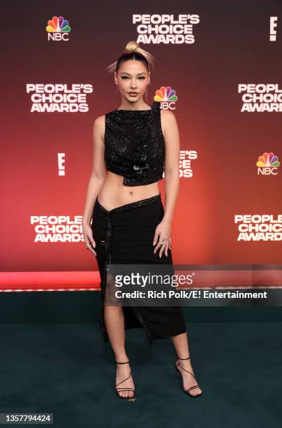 Pictured: Madelyn Cline arrives to the 2021 People's Choice Awards held at Barker Hangar on December 7, 2021 in Santa Monica, California.