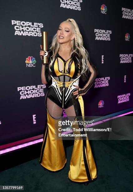 Pictured: (Christina Aguilera, recipient of The Music Icon of 2021 award, poses backstage during the 2021 People's Choice Awards held at Barker...
