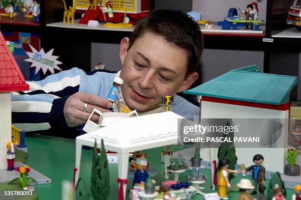 One of the founder of French society "Klikobil", Olivier Boulanger, poses in his shop on December 14, 2011 in Dremil-Lafage near Toulouse. Klikobil...