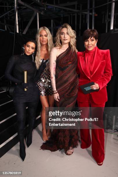 Pictured: Kim Kardashian West, Khloé Kardashian, Paris Jackson, and Kris Jenner pose during the 2021 People's Choice Awards held at Barker Hangar on...