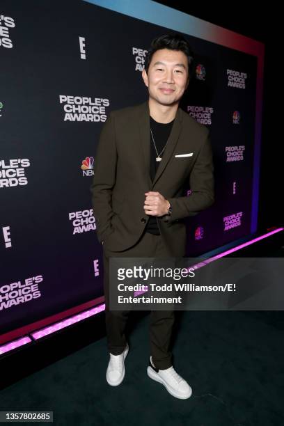 Pictured: Simu Liu, recipient of The Action Movie Star of 2021 for 'Shang-Chi and the Legend of the Ten Rings,' poses backstage during the 2021...