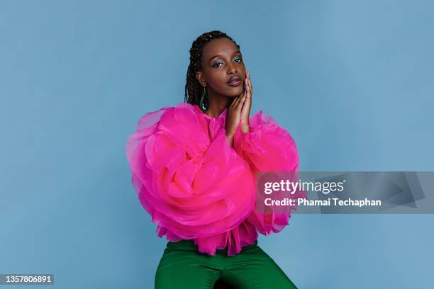 beautiful woman in front of plain background - green blouse stock pictures, royalty-free photos & images