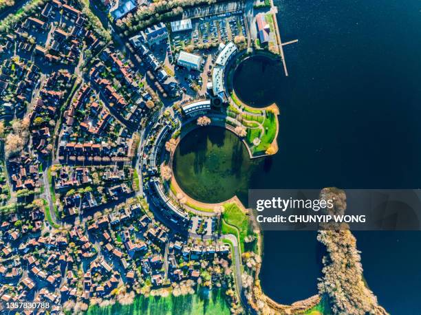 aerial footage of as typical suburban housing estates in the british town of milton keynes - uk town stock pictures, royalty-free photos & images