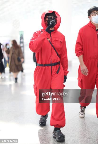 Singer and actor Jiro Wang dressed as character of series 'Squid Game' is seen at Shenzhen Baoan International Airport on December 8, 2021 in...