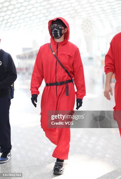 Singer and actor Jiro Wang dressed as character of series 'Squid Game' is seen at Shenzhen Baoan International Airport on December 8, 2021 in...