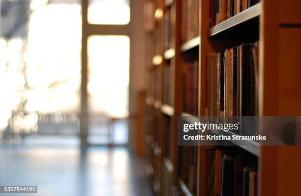 a shelf with books - philosophy book stock pictures, royalty-free photos & images