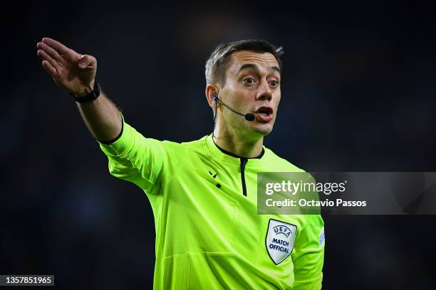 Match Referee, Clement Turpin gestures during the UEFA Champions League group B match between FC Porto and Atletico Madrid at Estadio do Dragao on...