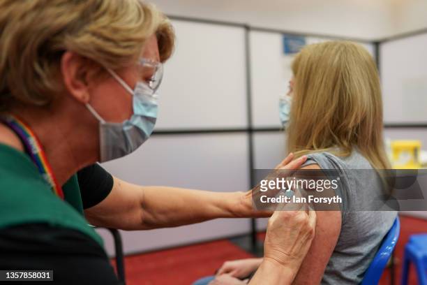 Lauren Robertson from Newcastle attends the Centre for Life Vaccination Centre to receive her Covid-19 booster on December 08, 2021 in Newcastle upon...