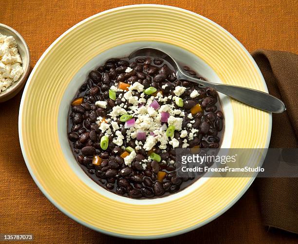 black bean soup sprinkled with queso crumbled cheese - black beans stock pictures, royalty-free photos & images