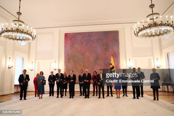 German President Frank-Walter Steinmeier poses with German Chancellor Olaf Scholz and ministers of the new cabinet at the end of a handover ceremony...