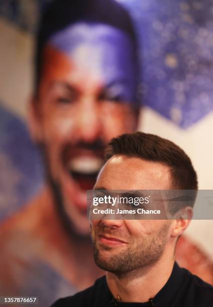 Josh Taylor speaks to the media during the Josh Taylor v Jack Catterall press conference at The Sports Direct Flagship store on December 08, 2021 in...