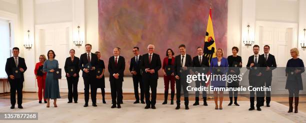 German President Frank-Walter Steinmeier poses with German Chancellor Olaf Scholz and ministers of the new cabinet at the end of a handover ceremony...