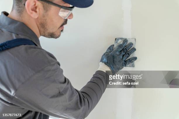 drywall sander - wall building feature stock pictures, royalty-free photos & images