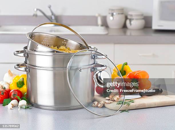 stainless pasta pot on kitchen counter with fresh vegetables - pan stock pictures, royalty-free photos & images