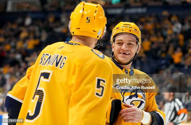Mark Borowiecki talks with Matt Benning of the Nashville Predators talk before a face-off against the Montreal Canadiens during an NHL game at...