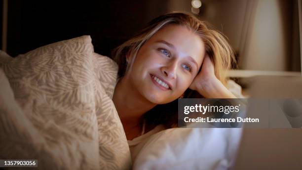 watching tv in bed cheerful - meme stock stock pictures, royalty-free photos & images