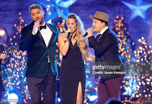In this image released on December 8th Brett Young, Colbie Caillat and Gavin DeGraw perform during CMT Crossroads in Franklin, Tennessee.
