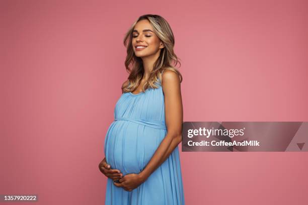 emotional pregnant woman - blue dress bildbanksfoton och bilder